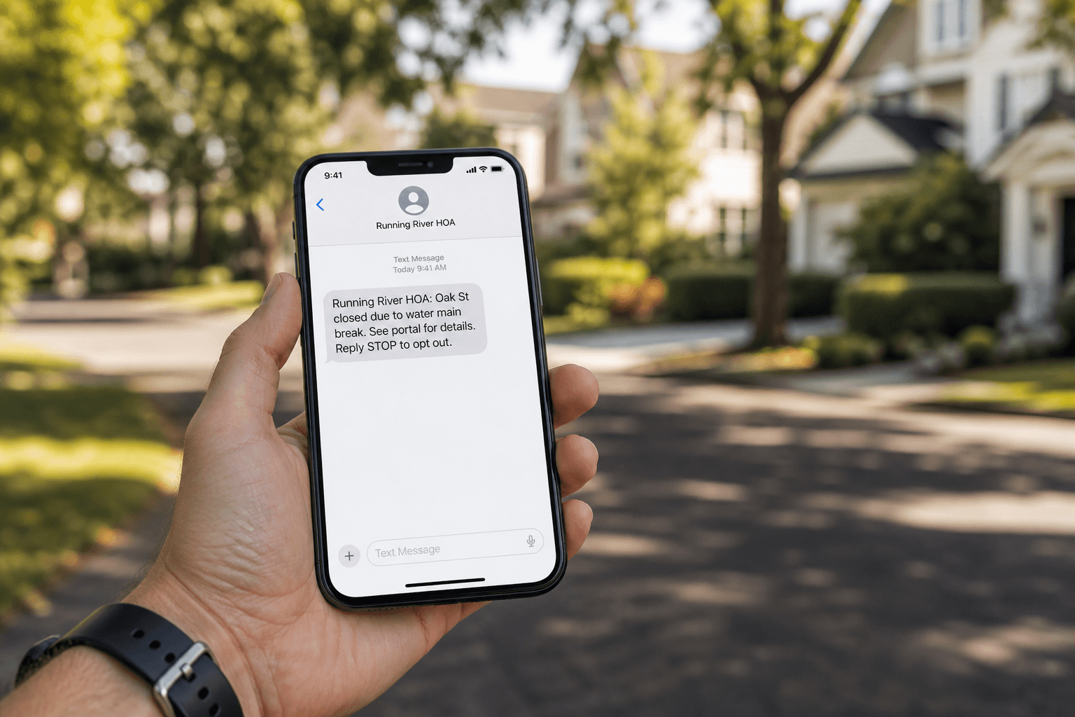 Resident holding a phone showing a Running River HOA BOLO text alert